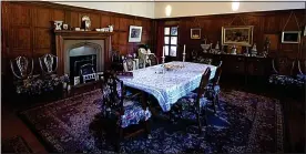  ??  ?? GRAND EDWARDIAN FEATURES: The fine dining room boasts a west-facing bay window and natural stone Arts and Crafts fireplace with oak mantel