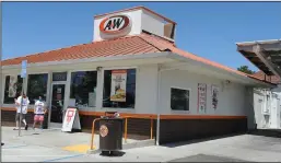  ??  ?? A&W Root Beer in Lodi, seen Wednesday, can no longer serve customers in the dining area.