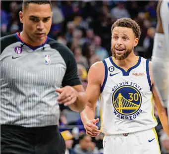  ?? Randall Benton/Associated Press ?? Warriors guard Stephen Curry (30) pleads his case with referee John Conley during the second half. With 27 points, Curry was held under 30 for only the third time this season.