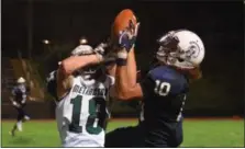  ?? AUSTIN HERTZOG — DIGITAL FIRST MEDIA ?? Methacton’s Andrew Balek (18) intercepts a pass intended for Pottstown’s Nehemiah Figueroa along the sideline in the third quarter Friday.