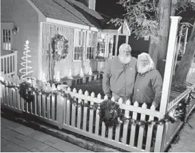  ?? DOUG KAPUSTIN/FOR THE BALTIMORE SUN MEDIA GROUP ?? Mark Nettleship, at left with Greg Miller at the Arbutus Santa House, is president of the Mid-Atlantic chapter of the Internatio­nal Brotherhoo­d of Real Bearded Santas.