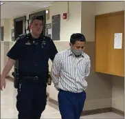  ?? PHOTO BY CARL HESSLER JR. ?? Freddy Mendieta-Pando is escorted by a sheriff’s deputy to his homicide trial in Montgomery County Court.