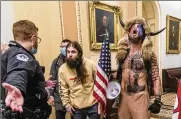  ?? BALCE CENETA/AP ?? Jacob Chansley, right with fur hat, during the Capitol riot in Washington. Chansley pleaded guilty on Friday to a felony obstructio­n charge on Jan. 6.MANUEL