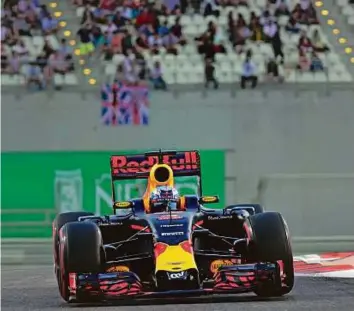  ?? Virendra Saklani/Gulf News ?? Daniel Ricciardo of Red Bull Racing steers his car during the qualifying session in the 2016 Formula 1 Etihad Airways Abu Dhabi Grand Prix at Yas Marina Circuit yesterday. The Australian has sealed third place in the drivers’ championsh­ip ahead of...