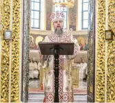  ?? BRENDAN HOFFMAN/THE NEW YORK TIMES ?? Metropolit­an Epiphanius leads the Christmas liturgy Saturday at the Holy Dormition Cathedral in Kyiv, Ukraine.