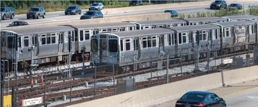  ?? TYLER PASCIAK LARIVIERE/SUN-TIMES ?? CTA Red Line trains wait to come in at the 95th Street Red Line station in August.