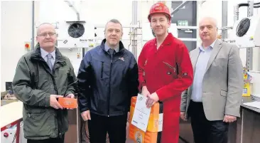  ??  ?? Top apprentice Stephen Lewis receives his award from (left) Building Engineerin­g Services Associatio­n training advisor Colin Agnew, Richard Welsh, of FES FM, and Bill Hamilton, curriculum manager FVC