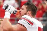  ?? DAVID JABLONSKI / STAFF 2019 ?? Ohio State’s Josh Myers gets a drink before the spring game on Saturday, April 13, 2019, at Ohio Stadium in Columbus.