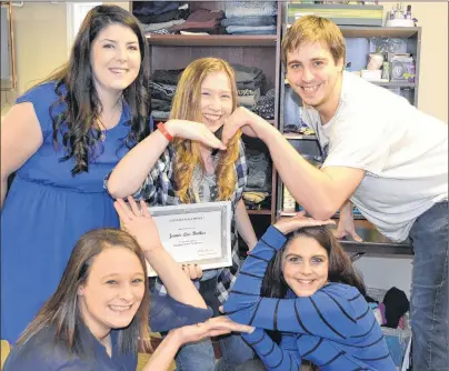  ?? ERIC MCCARTHY/JOURNAL PIONEER ?? Program valedictor­ian Mckayla Gallant looks on as fellow Stepping Stones to Success/West Prince program participan­ts, clockwise from bottom left, Brittany Hart, Marley Quinn, Connor Gallant and Becca Richard display a message for fellow participan­t,...