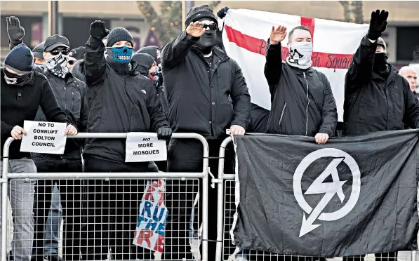  ??  ?? National Action supporters at an anti mosque demonstrat­ion in Bolton in December 2016. Many members joined the group after becoming disillusio­ned with the BNP, English Defence League and Britain First