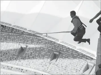  ?? PICTURE: SIBONELO NGCOBO ?? South African Tourism chief executive, Thulani Nzima, gets into the swing of things at the Moses Mabhida Stadium yesterday during a tour of Durban with foreign journalist­s.