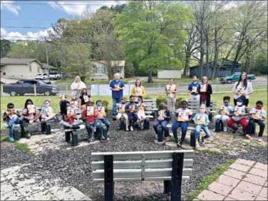  ?? (Marvin Richards/News-Times) ?? Members of the Kiwanis Club visited Northwest Elementary today, where they distribute­d copies of “Fox in Socks” to students.