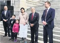  ?? PHOTO: CRAIG SMITH ?? Handing it over . . . New Zealand First MPs Fletcher Tabuteau (left), Winston Peters and Mark Patterson were on hand when South Otago farmer Amy Blaikie and her children Caitlyn (4) and Josh (8), handed over a wool petition in Wellington yesterday.