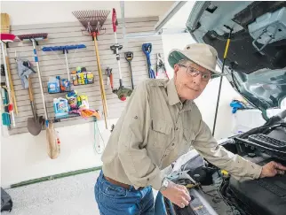  ?? JAMES PARK ?? “Now, even though I have the same junk, it looks neater. It’s so convenient,” says Brian Pringle, who had his garage renovated by Ottawa Garage Makeovers. He had a new resin coating put on the floor and heating installed to make wintertime puttering...