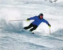  ?? — AP ?? In this, file photo, a skier kicks up some fresh powder during opening day at Arapahoe Basin in Dillon, Colo.