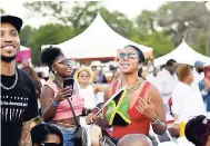  ??  ?? A Groovin’ In The Park audience member shows her love for Jamaica.