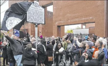  ?? Matt Born The Associated Press ?? The new North Carolina highway historical marker about the 1898 “Wilmington Coup” is unveiled during a dedication ceremony Friday in Wilmington, N.C.