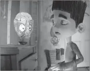  ?? LAIKA INC. ?? Norman, who lives in a world of his own, gets spooked by his lamp in ParaNorman, a zombie movie for kids.