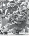  ?? NWA Democrat-Gazette/BEN GOFF ?? Arkansas linebacker De’Jon Harris (right) drags down LSU’s Darrel Williams on Saturday. Harris led the Hogs with 12 tackles.