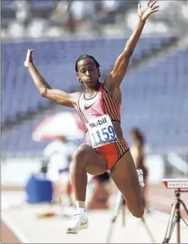  ?? David Longstreat­h / Associated Press ?? Gymnastics, Jackie Joyner-kersee, shown in 1996 competing in the long jump portion of the heptathlon at the Olympics, says people want to race her.