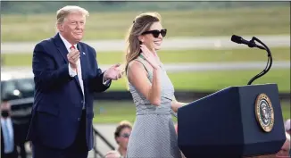 ?? Brendan Smialowski / AFP via Getty Images ?? President Donald Trump listens as aide Hope Hicks, a member of the Greenwich High School Class of 2006, speaks during a Make America Great Again rally at Ocala Internatio­nal Airport in Ocala, Fla., on Friday.