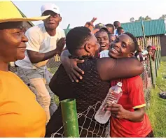  ?? ?? AIN’T NOTHING LIKE A MOTHER’S LOVE . . . Stephen Chatikobo is embraced by his mother Sarudzai after the Green Fuel -Simba Bhora match at Green Fuel Stadium