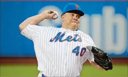  ?? KATHY WILLENS/AP PHOTO ?? New York Mets starting pitcher Bartolo Colon delivers during the first inning Monday against the Atlanta Braves. Colon pitched eight scoreless innings and the Mets homered three times in the first inning of a 4-1 victory.