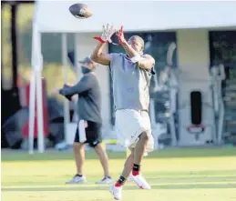  ?? DOUGLAS R. CLIFFORD/AP ?? Buccaneers running back LeSean McCoy works through a passing drill during training camp on Tuesday in Tampa.