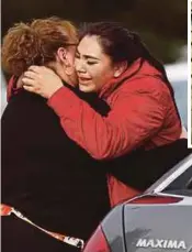  ?? AGENCY PIX ?? A woman (right) embracing another woman after escaping from the Pathway Home siege in Yountville, California on Friday. (Inset) Albert Wong