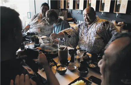  ?? Sophia Germer / The Chronicle 2015 ?? At Nabe in S.F.’s Inner Sunset neighborho­od, a group that included retired sumo wrestlers Yamamotoya­ma Ryuta and Ulambayary­n Byambajav shared hot pot in 2015.