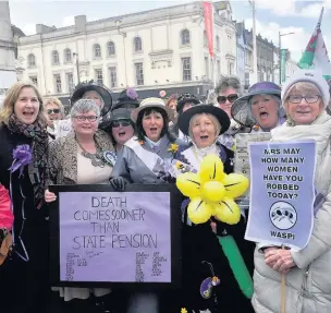  ??  ?? Campaigner­s taking part in the Waspi March in Cardiff city centre last week