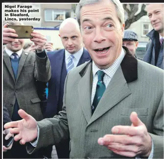  ??  ?? Nigel Farage makes his point in Sleaford, Lincs, yesterday