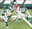  ?? Mike Stobe / Getty Images ?? DeAndre Hopkins of the Cardinals catches a fourth-quarter touchdown against the Jets on Sunday.