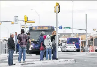  ??  ?? PEDESTRIAN FRIENDLY: A pedestrian crosswalk area is full of people waiting to cross South Congress Avenue on Sunday. South Congress, once a spacious commuter route, is now a gantlet of traffic signals and ‘bulb out’ concrete islands that have...