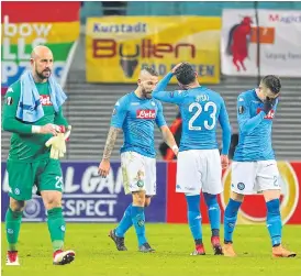 ??  ?? Napoli players react after the match against RB Leipzig.