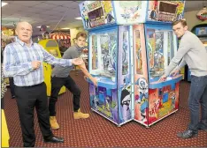  ?? ?? David Cain with sons Tom and Bill and their latest amusement machine at Cain’s Amusements in Herne Bay