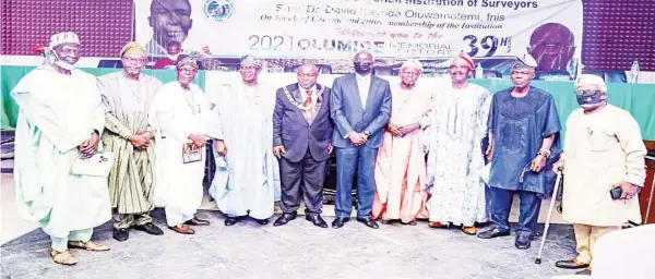  ?? ?? Past presidents, Nigerian Institutio­n of Surveyors ( NIS) Yakubu Maikano ( left); Akinloye Oyegbola; Olusola Atilola; Bosun Ayinde; NIS President, Kayode Oluwamotem­i; Minister of Works and Housing, Mr. Babatunde Fashola; Solomon Jaiye Ojeikere; Bern Omo- Aigbe; Bode Adeaga and Alabo Charlye David Charles during the 39th Annual Olumide Memorial Lecture organised by the institutio­n and delivered by the minister on the theme, " Human Capital and Institutio­n Building," in Abuja.