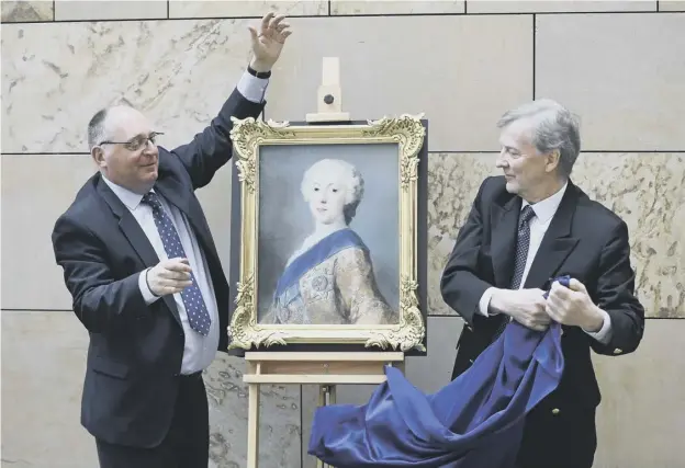  ??  ?? 0 David Forsyth, principal curator in Scottish history at the museum, unveils the portrait of the young Bonnie Prince Charlie with Peter Pininiski of the Pininski Foundation