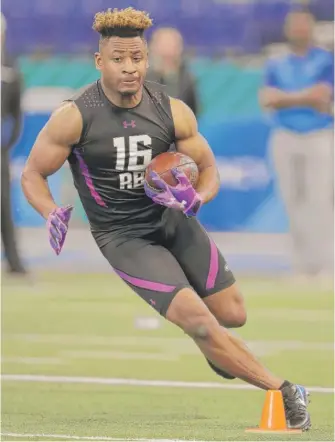  ?? | MICHAEL CONROY/ AP ?? Justin Jackson ran a respectabl­e 4.5- second 40- yard dash at the combine Friday.