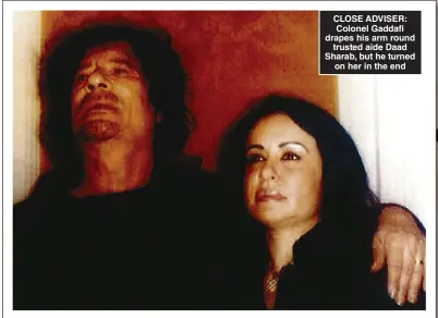  ?? ?? CLOSE ADVISER: Colonel Gaddafi drapes his arm round trusted aide Daad Sharab, but he turned on her in the end