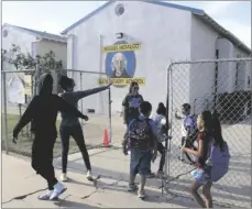  ?? SARINA E. GUERRA PHOTO ?? Parents and guardians walk their children up to the gates at Miguel Hidalgo Elementary School on Wednesday, May 17, in Brawley.