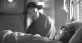  ?? ORSON WELLES Netf l i x ?? ( Tom Burke) visits a bedridden Mankiewicz ( Gary Oldman).