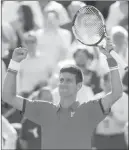  ?? VINCENT KESSLER/ REUTERS ?? Top-ranked Novak Djokovic of Serbia celebrates after defeating nine-time French Open champion Rafael Nadal of Spain 7-5, 6-3, 6-1 in a quarterfin­al match at Roland Garros on Wednesday.