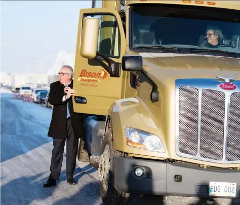  ?? TROY FLEECE ?? Joe Hargrave, minister responsibl­e for SGI, rode to Monday’s truck driver training announceme­nt in a Bison Transport tractor unit.