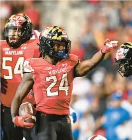  ?? GAIL ?? Maryland running back Roman Hemby gestures for a first down during a win over SMU. BURTON/AP