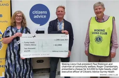  ?? WOKING LIONS CLUB ?? Woking Lions Club president Paul Robinson and chairman of community welfare, Roger Chamberlai­n, presented a cheque for £2,000 to Kate Sawdy, chief executive officer of Citizens Advice Surrey Heath