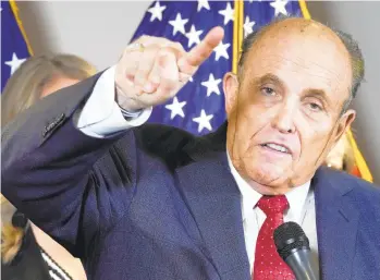  ?? JACQUELYN MARTIN/AP ?? What appears to be hair dye runs down the cheeks of Rudy Giuliani, a lawyer for President Donald Trump, as he speaks during a news conference at the Republican National Committee headquarte­rs on Thursday in Washington.
