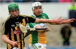  ?? SPORTSFILE ?? Sticking it out: Kilkenny’s Martin Keoghan is tackled by David O’Toole Green of Offaly yesterday