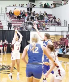  ?? Mark Ross/Special to the Herald-Leader ?? Siloam Springs senior Mimo Jacklik (left) launches a 3-pointer during the first half of Friday’s homecoming game against Harrison. Jacklik hit eight 3-pointers and scored a career high 31 points in the Lady Panthers’ 59-42 victory.