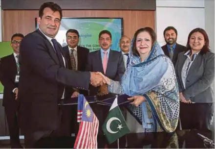  ??  ?? AJ Biologics chief operating officer Jerome Cabannes (left) exchanging documents with the government of Khyber Pakhtunkhw­a secretary for Industries, Commerce and Technical Education Farah Hamid after the signing ceremony in Kuala Lumpur recently.